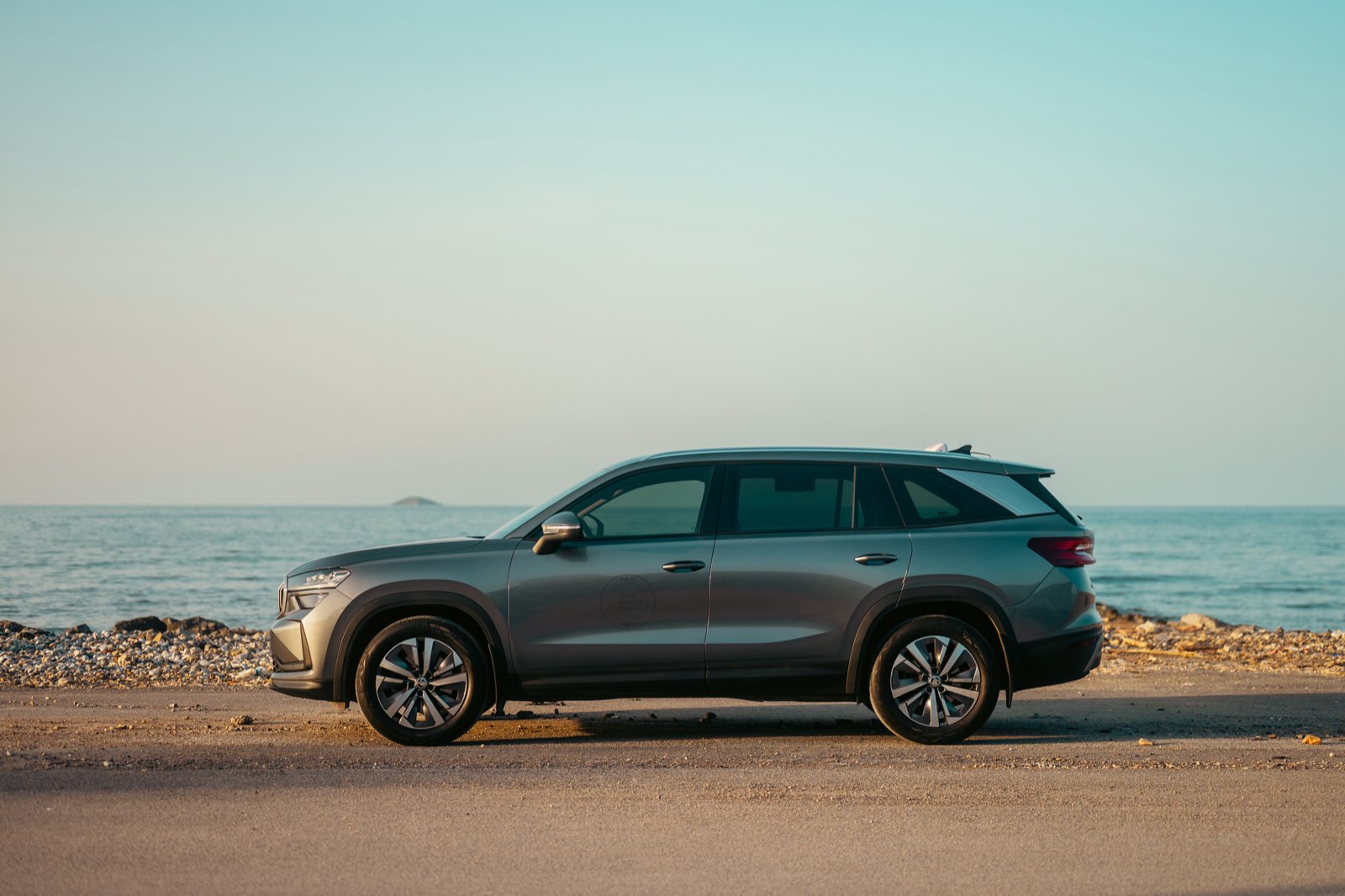 LP Taxi vehicle side profile on a coastal road in Crete