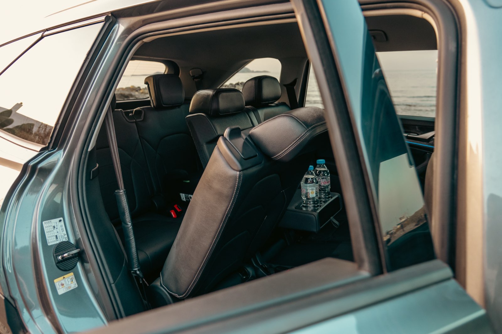 Spacious leather rear seats inside LP Taxi with sea view