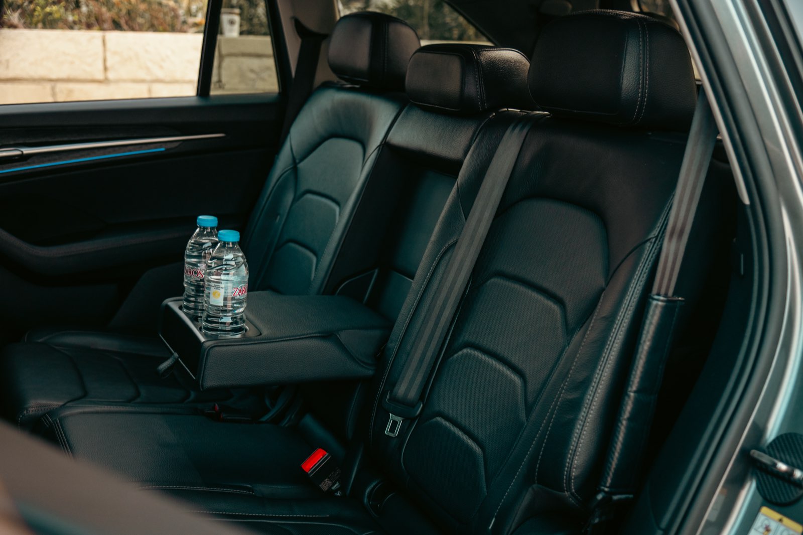 LP Taxi rear seats with complimentary water bottles for passengers