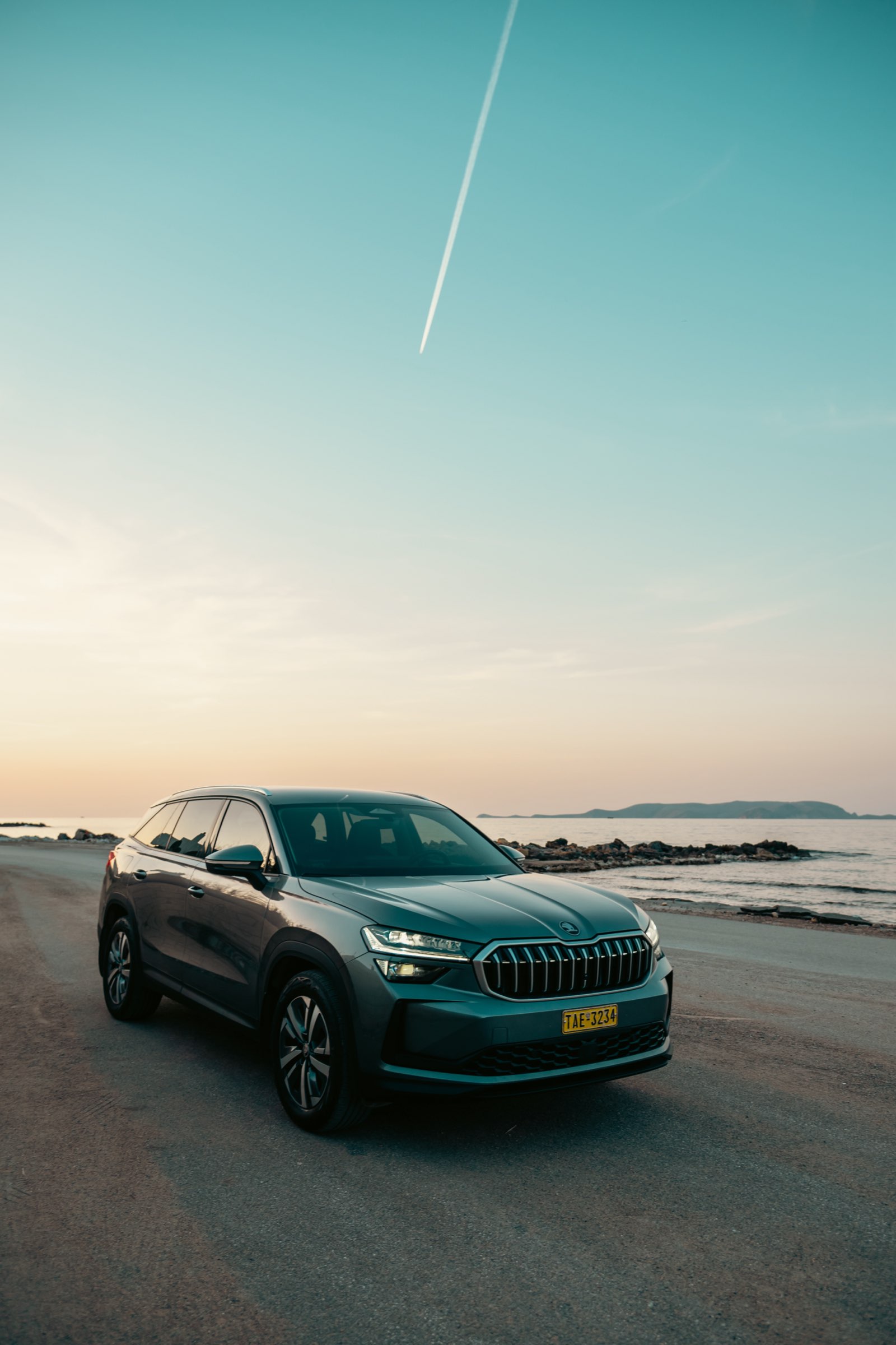 LP Taxi SUV front view parked at a Crete seaside road at sunset